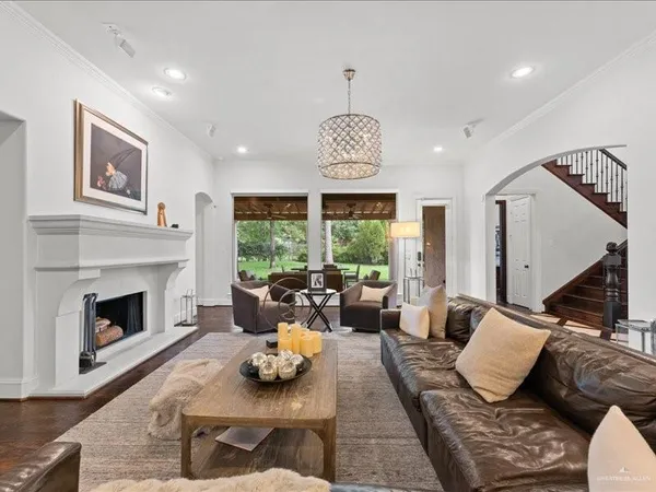 a living room with furniture fireplace and window