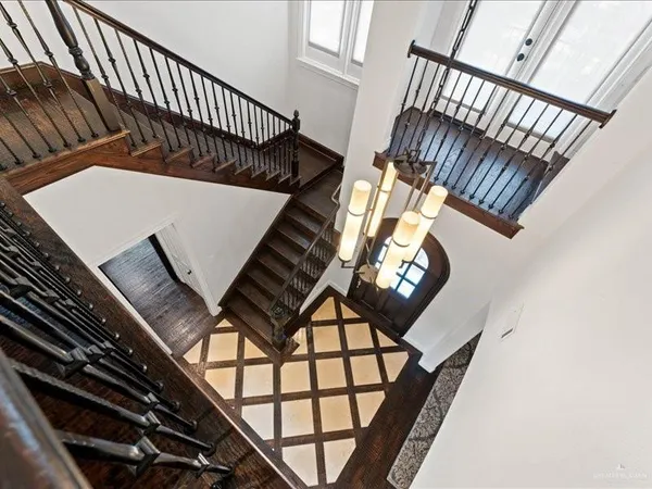 a view of staircase going to ceiling window and stairs