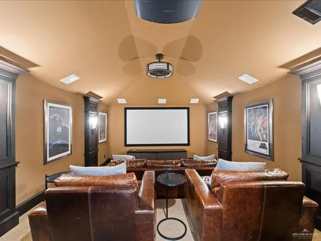 a room with furniture and a projector screen