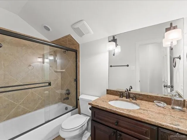 a bedroom with a bed and a table with chair