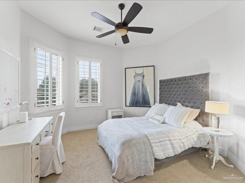 7 Ivy Castle Court Spring, TX 77382 - Photo 40 of 45 a bedroom with a bed and a table with chair