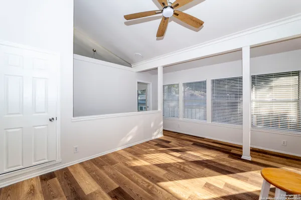 a view of an empty room with a window