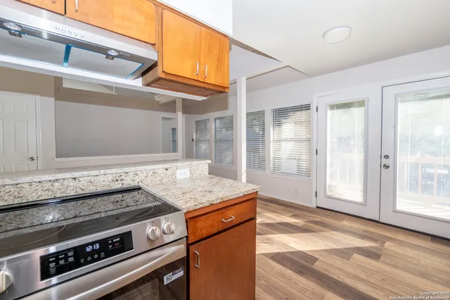 a kitchen with a stove and a sink