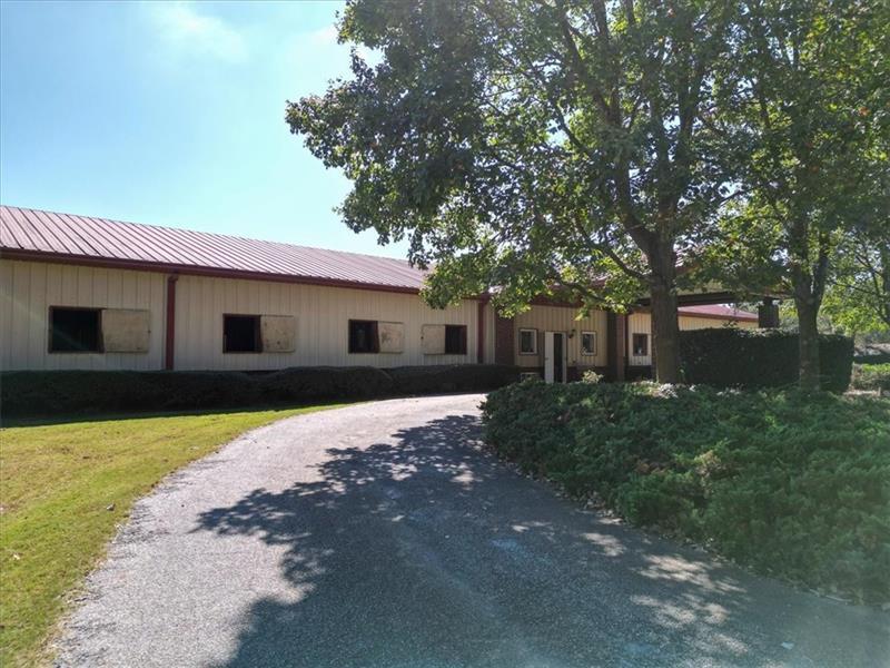 3055 A Spring Hill Drive Monroe, GA 30656 - Photo 11 of 65 a front view of a house with a garden