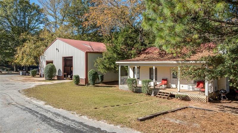 3055 A Spring Hill Drive Monroe, GA 30656 - Photo 30 of 65 a view of a house with a patio and a yard