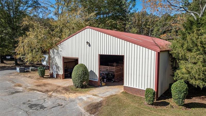 3055 A Spring Hill Drive Monroe, GA 30656 - Photo 31 of 65 a view of a house with a yard and garage