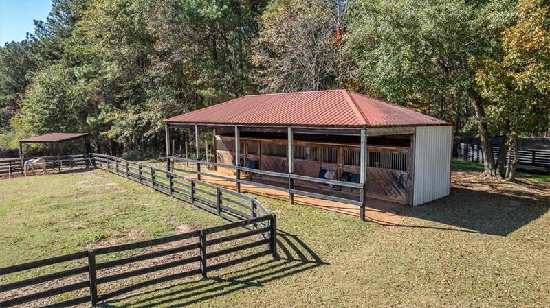 3055 A Spring Hill Drive Monroe, GA 30656 - Photo 38 of 65 a view of a house with swimming pool and sitting area