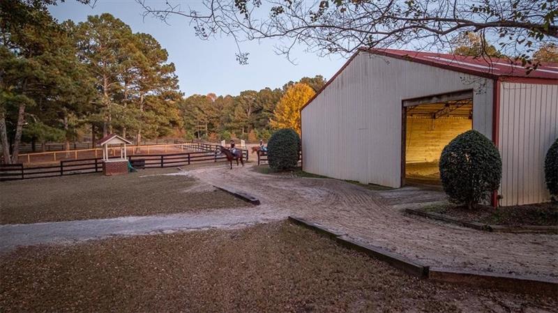 3055 A Spring Hill Drive Monroe, GA 30656 - Photo 44 of 65 a backyard of a house with barbeque oven and wooden fence