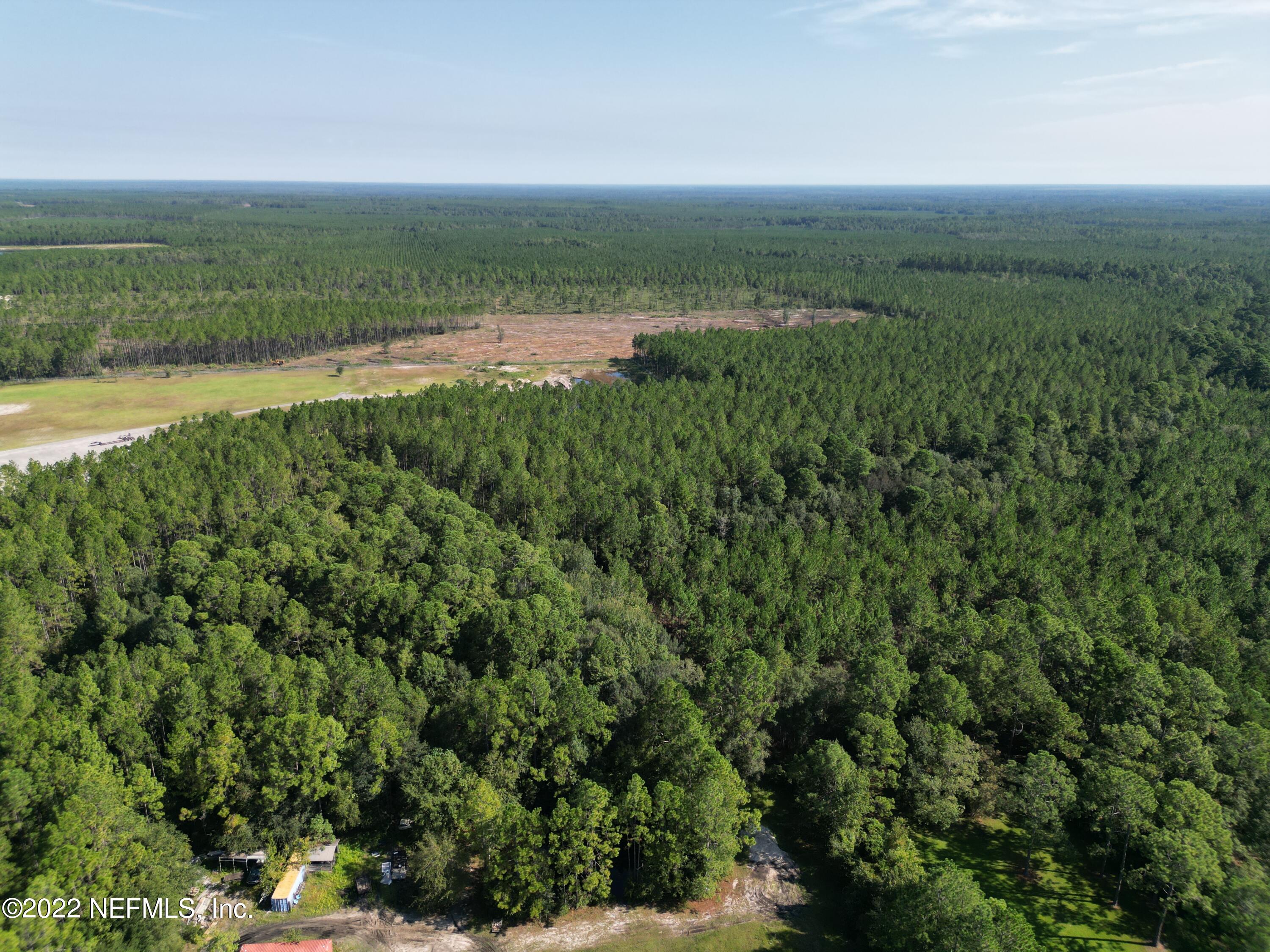 2268 D E Long Road Macclenny, FL 32063 - Photo 11 of 14 a view of a green field with lots of green space