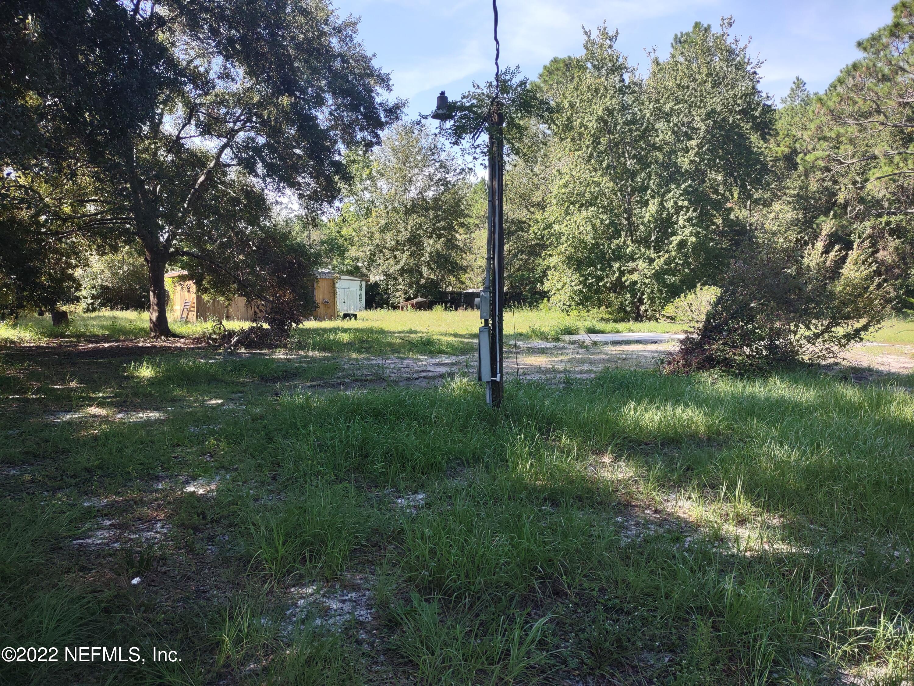 2268 D E Long Road Macclenny, FL 32063 - Photo 2 of 14 a view of a yard with a tree