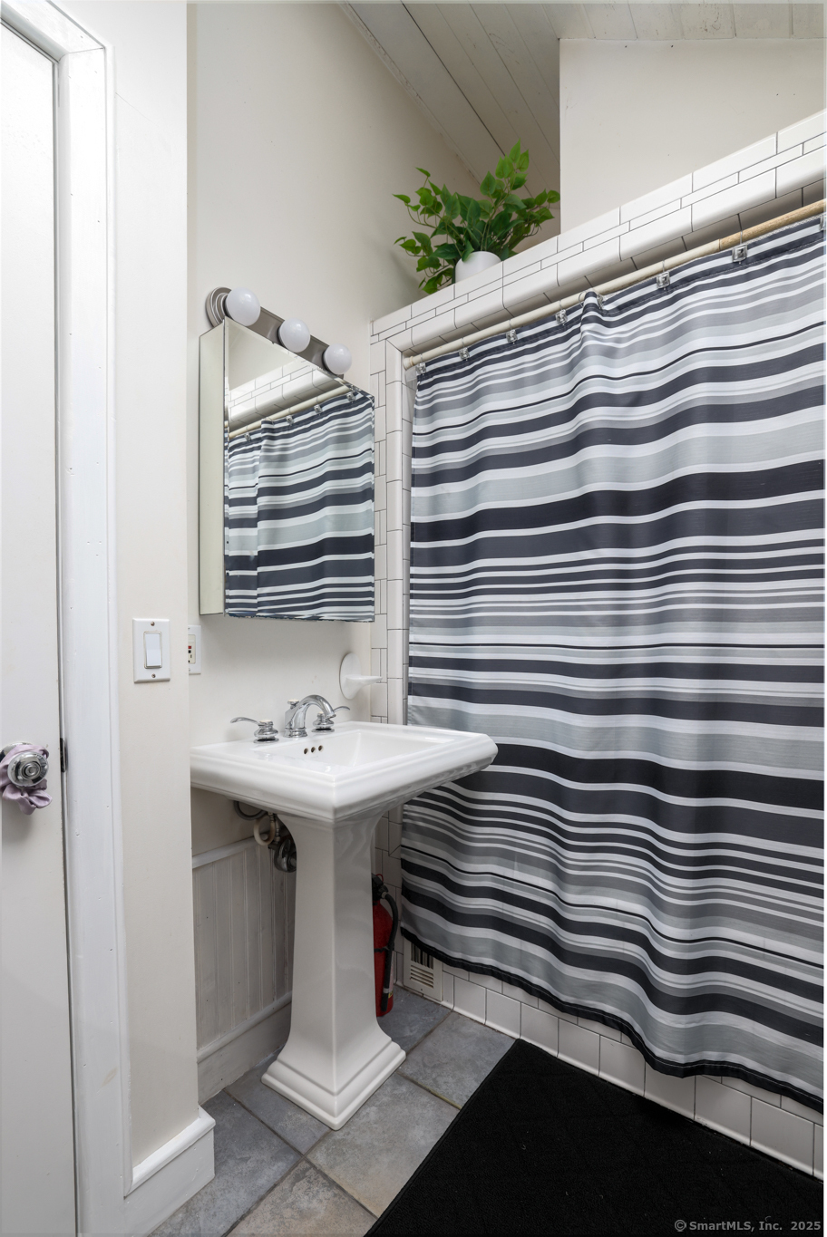 266 Old Forge Road Riverton, CT 06065 - Photo 21 of 40 a bathroom with a sink and a mirror