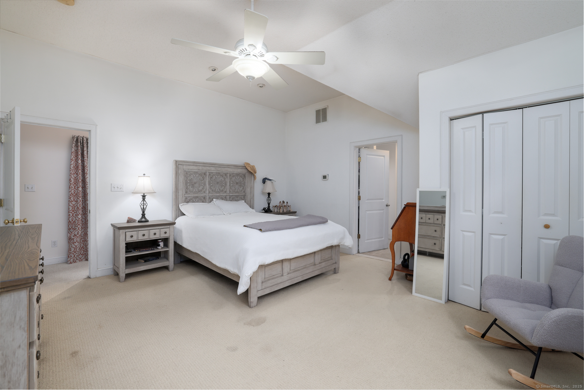 266 Old Forge Road Riverton, CT 06065 - Photo 23 of 40 a bedroom with a bed and a chandelier