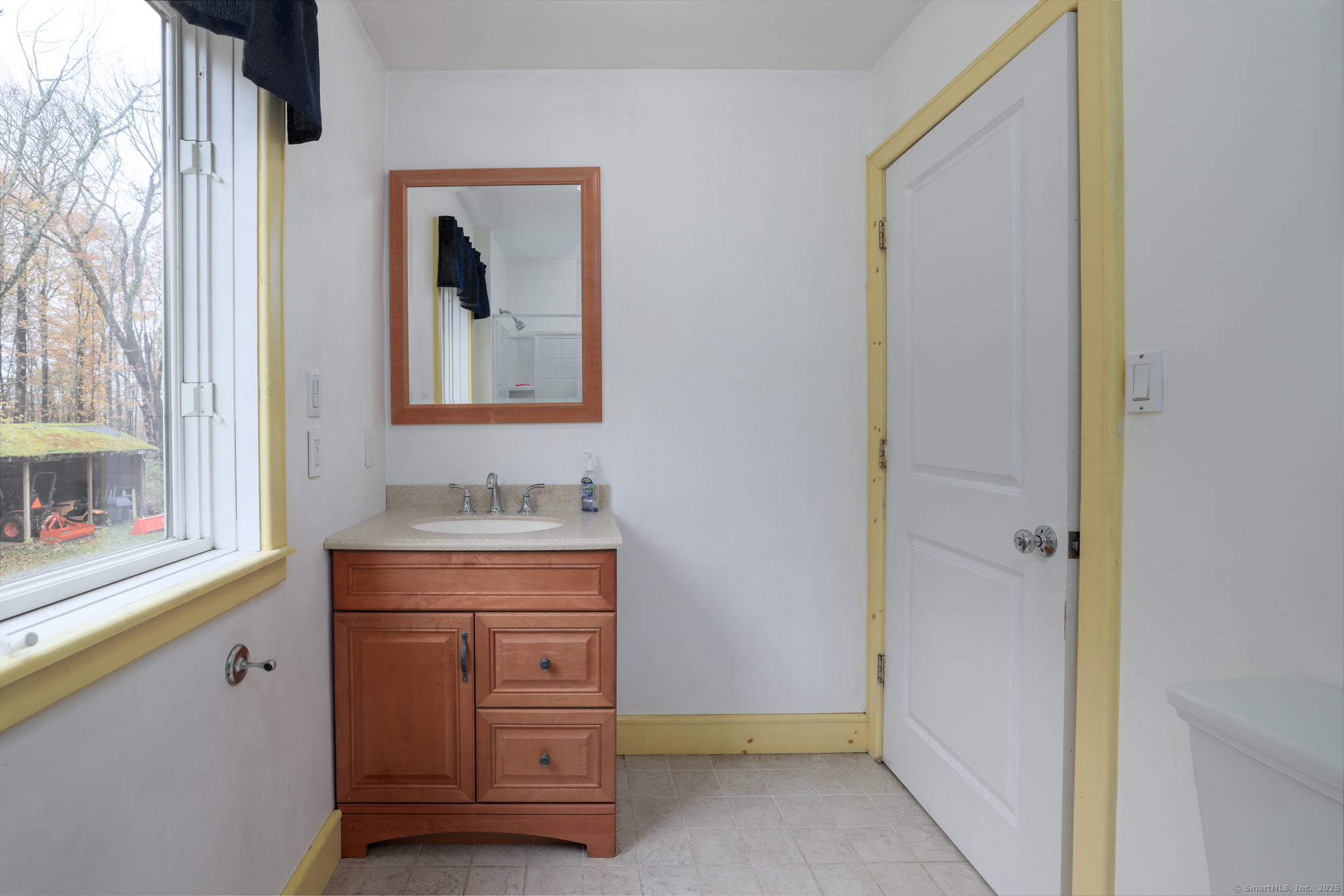 266 Old Forge Road Riverton, CT 06065 - Photo 28 of 40 a room with a door and a mirror