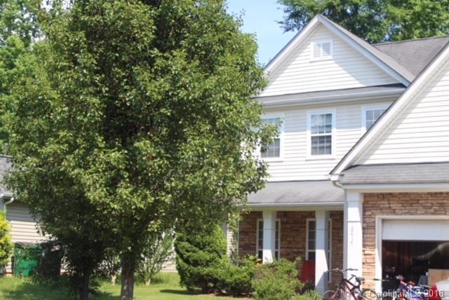 a view of a house with a tree