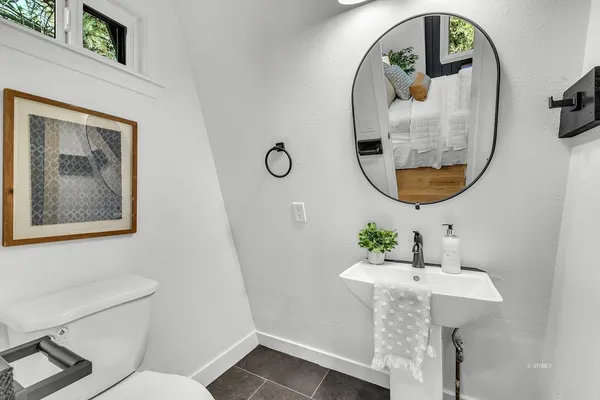 a bathroom with a sink and mirror