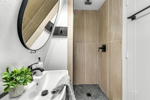 a bathroom with a sink and a mirror
