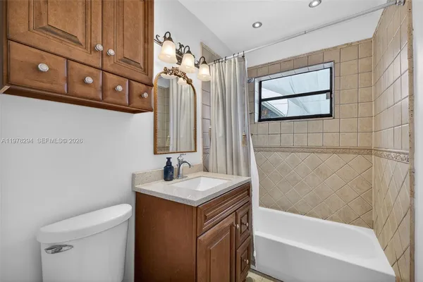 a bedroom with a bed and a chair