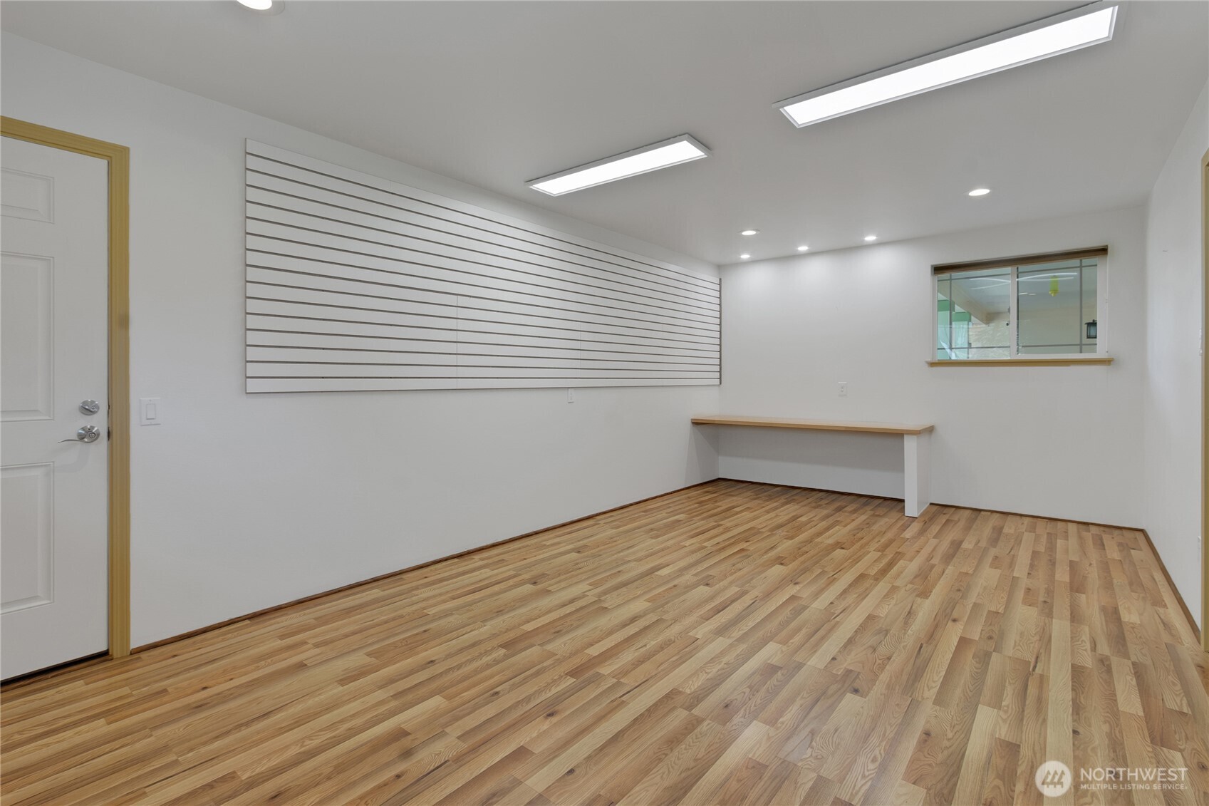 1450 Southeast Spruce Road Port Orchard, WA 98367 - Photo 30 of 39 a view of an empty room with wooden floor and a window