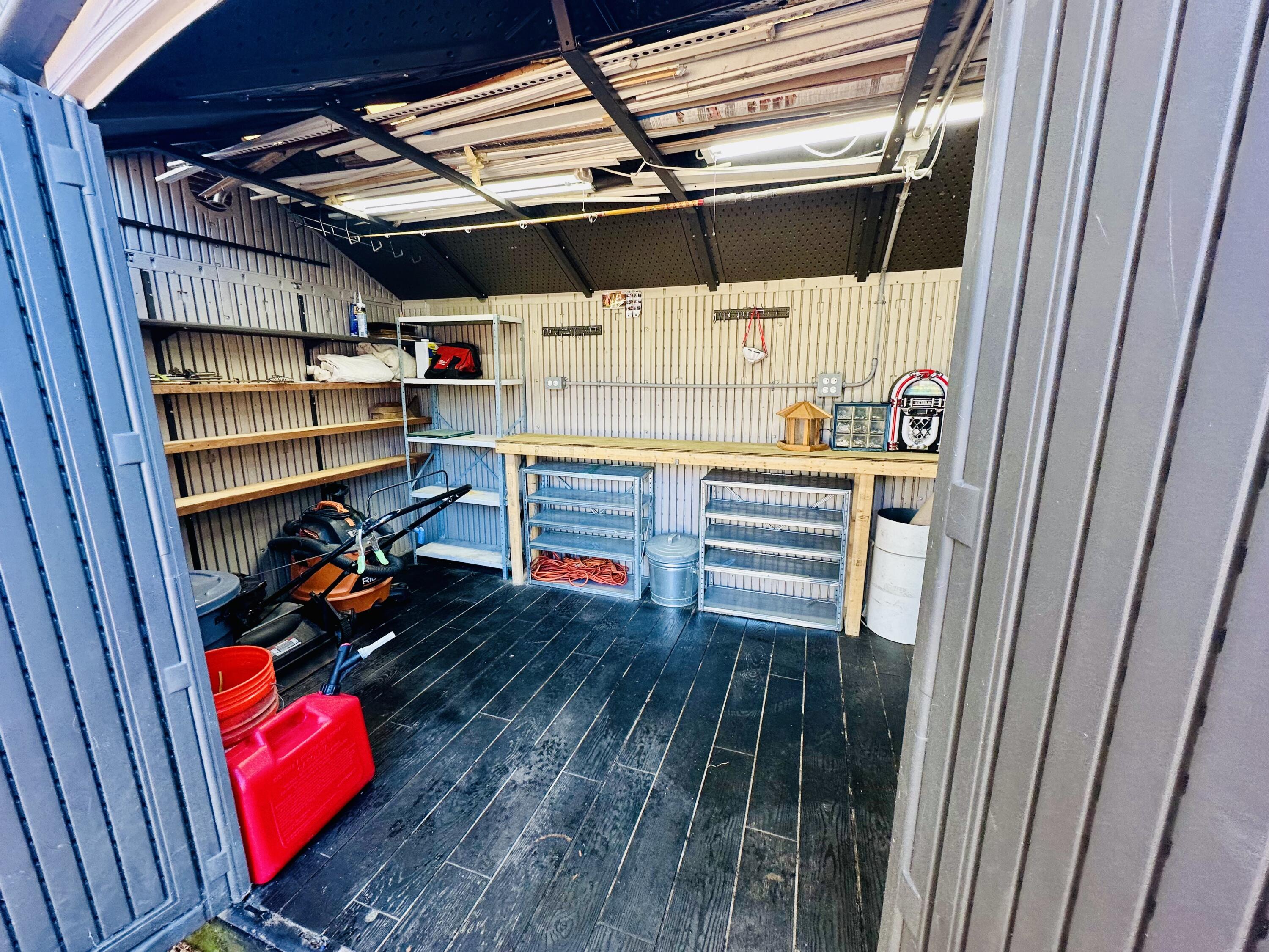 5 3rd Avenue Bourne, MA 02559 - Photo 13 of 18 a view of walk in closet with clothes and shoes