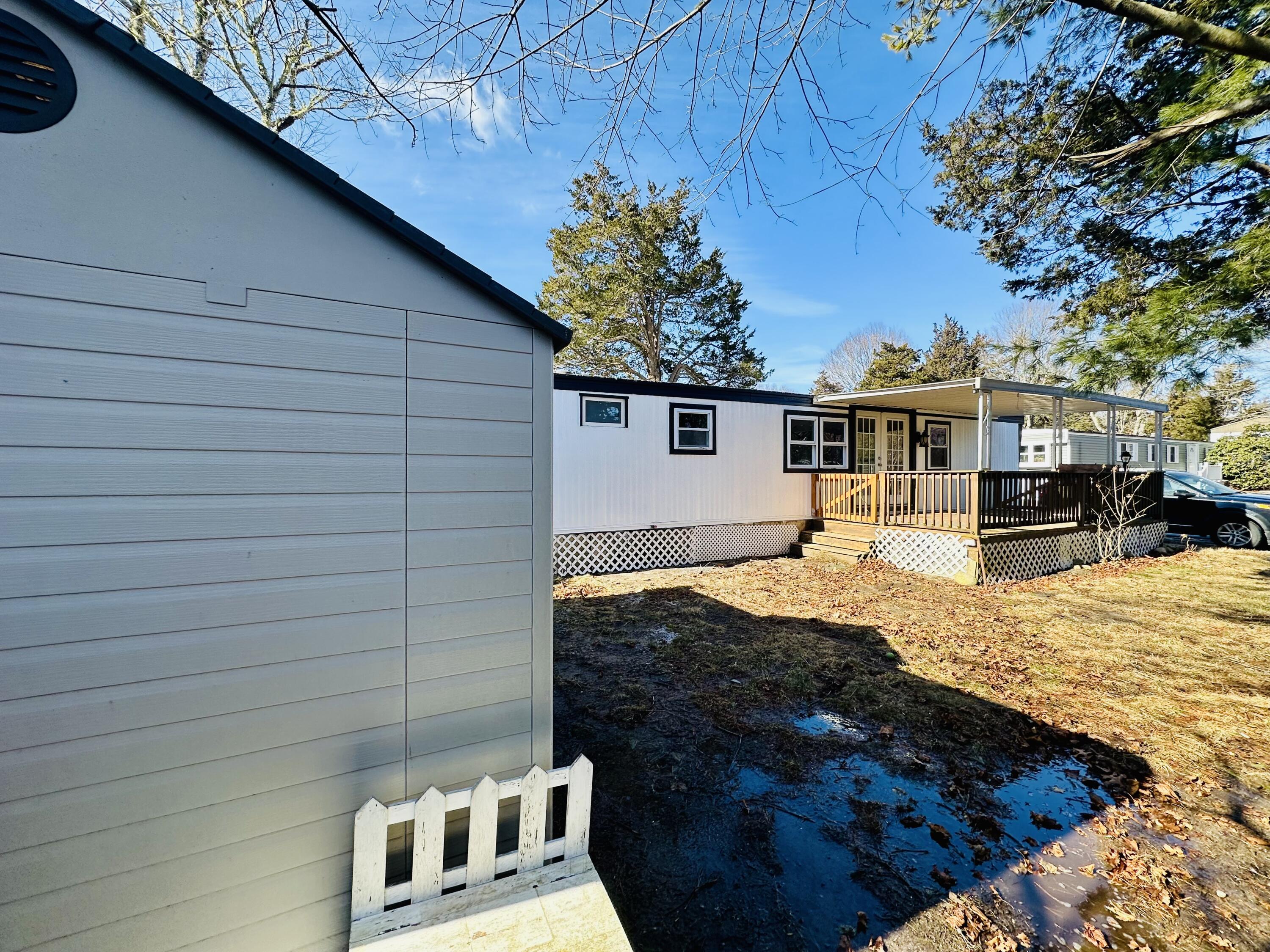 5 3rd Avenue Bourne, MA 02559 - Photo 5 of 18 a view of a house with a patio