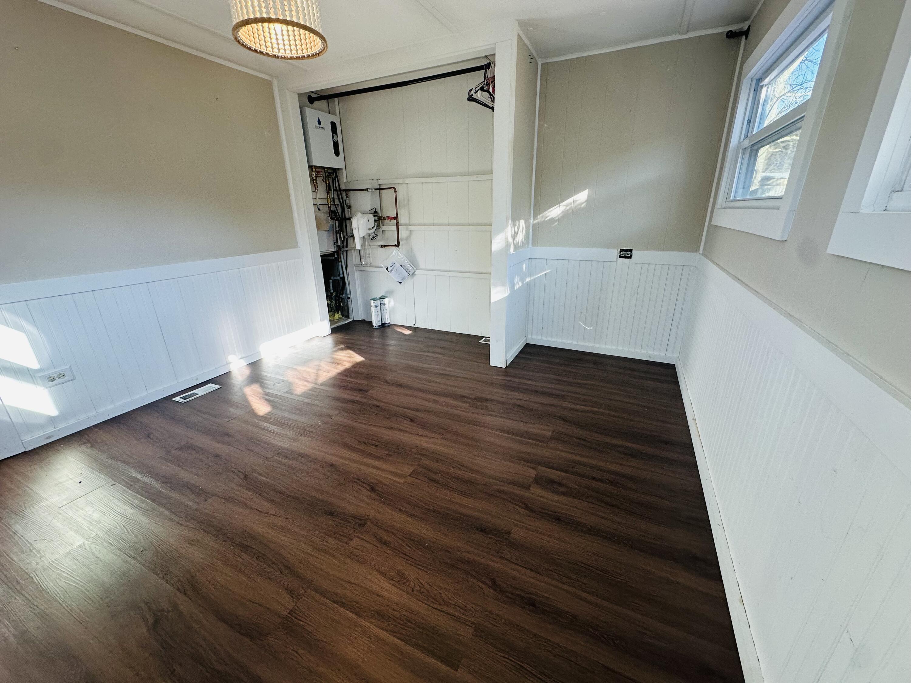 5 3rd Avenue Bourne, MA 02559 - Photo 9 of 18 a view of empty room with wooden floor and fan