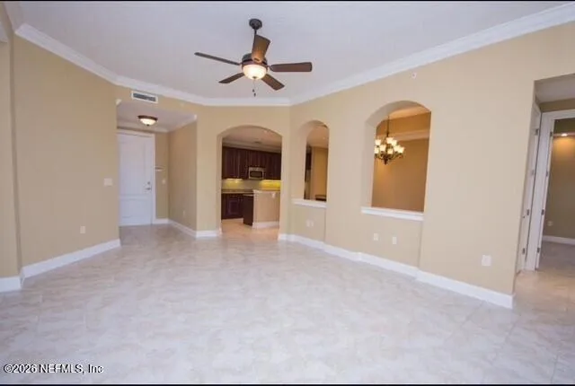 a view of empty room with a ceiling fan