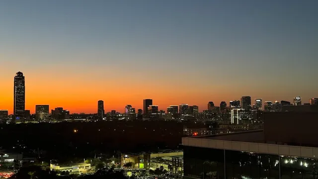 a hallway with a sink and chandelier