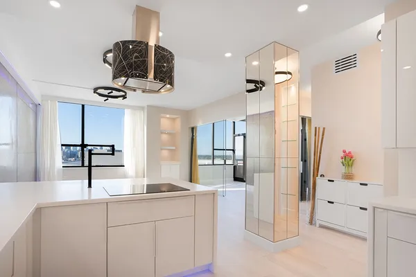 a kitchen with a sink and refrigerator