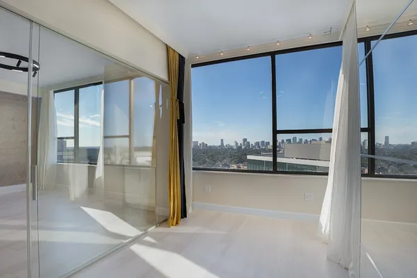 a view of a bathroom with a tub and shower