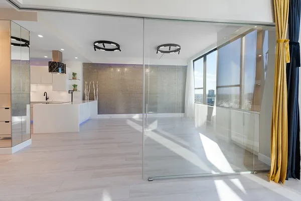 a view of a bathroom with a tub and shower