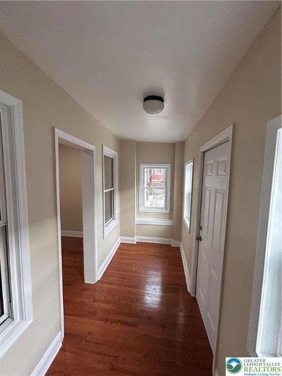 1041 East 3rd Street Bethlehem, PA 18015 - Photo 2 of 5 a view of a hallway with wooden floor and a living room