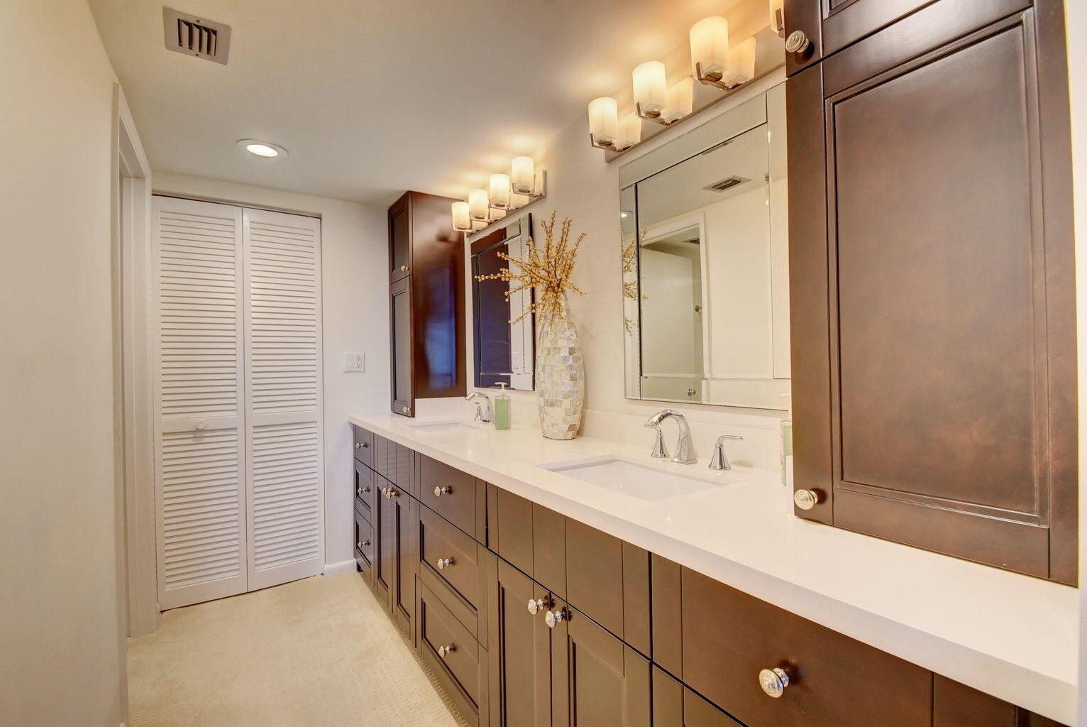 3400 South Ocean Boulevard, Unit 4I Highland Beach, FL 33487 - Photo 11 of 14 a bathroom with a double vanity sink and a mirror