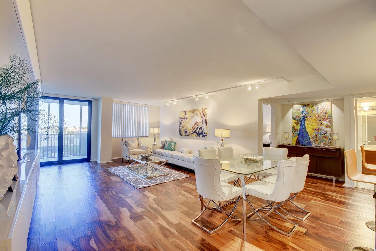 3400 South Ocean Boulevard, Unit 4I Highland Beach, FL 33487 - Photo 8 of 14 a living room with fireplace furniture and a wooden floor