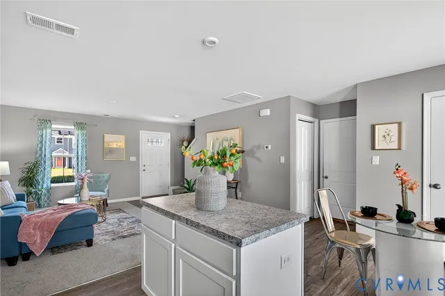 a kitchen with stainless steel appliances granite countertop a sink and cabinets