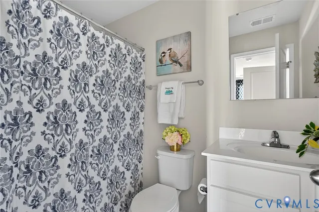 a bathroom with a toilet and a sink