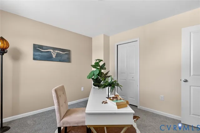 a view of a workspace with furniture