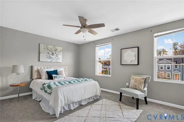 a bedroom with a large bed and a window