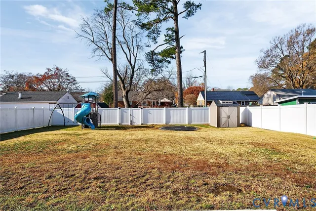 a backyard of a house with wooden fence