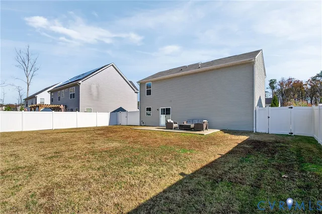a house view with a backyard space