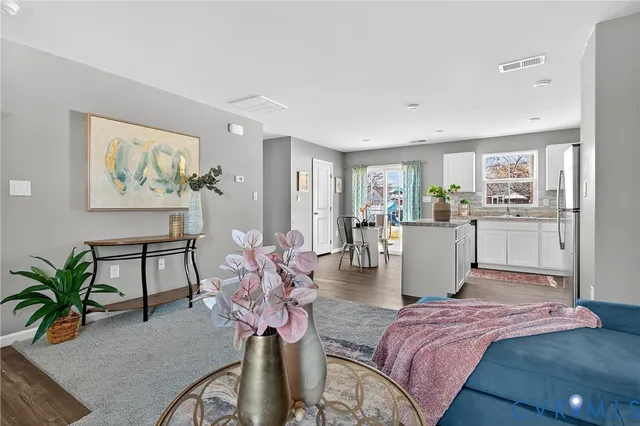 a bedroom with furniture and a painting