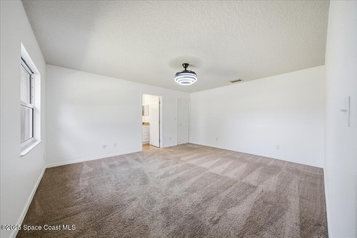6424 Muller Avenue Cocoa, FL 32927 - Photo 18 of 33 a view of an empty room with a window