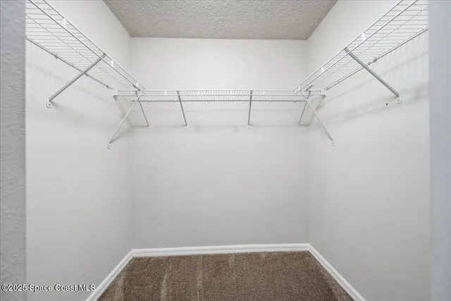 a view of a room with racks on the wall