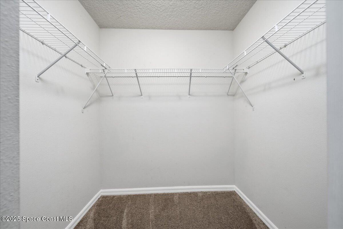 6424 Muller Avenue Cocoa, FL 32927 - Photo 19 of 33 a view of a room with racks on the wall