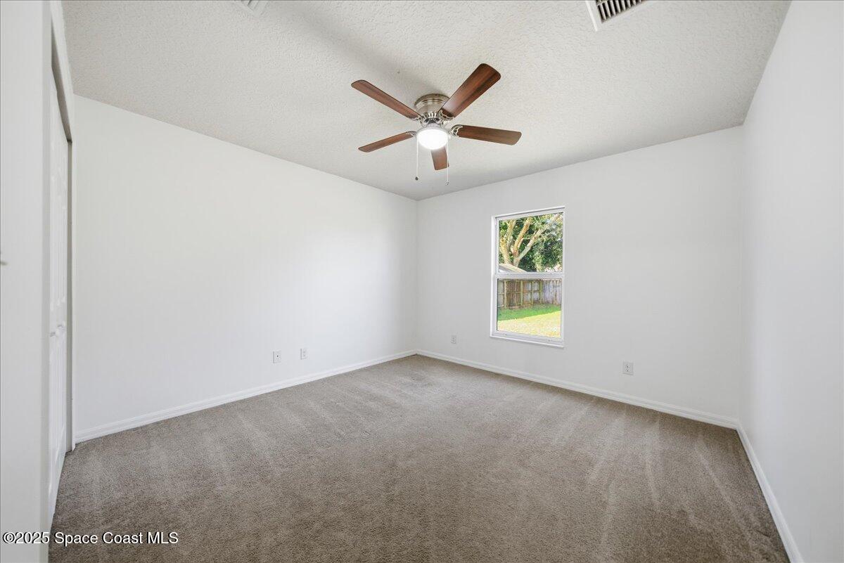 6424 Muller Avenue Cocoa, FL 32927 - Photo 20 of 33 a view of room with window and ceiling fan