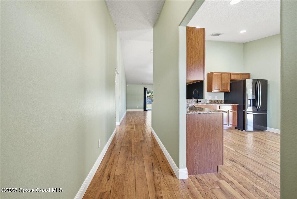 6424 Muller Avenue Cocoa, FL 32927 - Photo 24 of 33 a view of kitchen with stainless steel appliances wooden floor