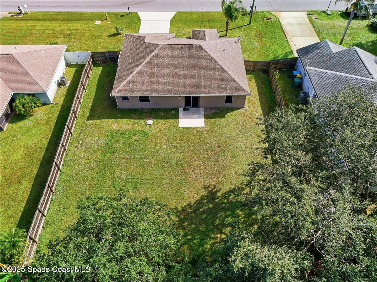 6424 Muller Avenue Cocoa, FL 32927 - Photo 27 of 33 an aerial view of residential houses with outdoor space and swimming pool