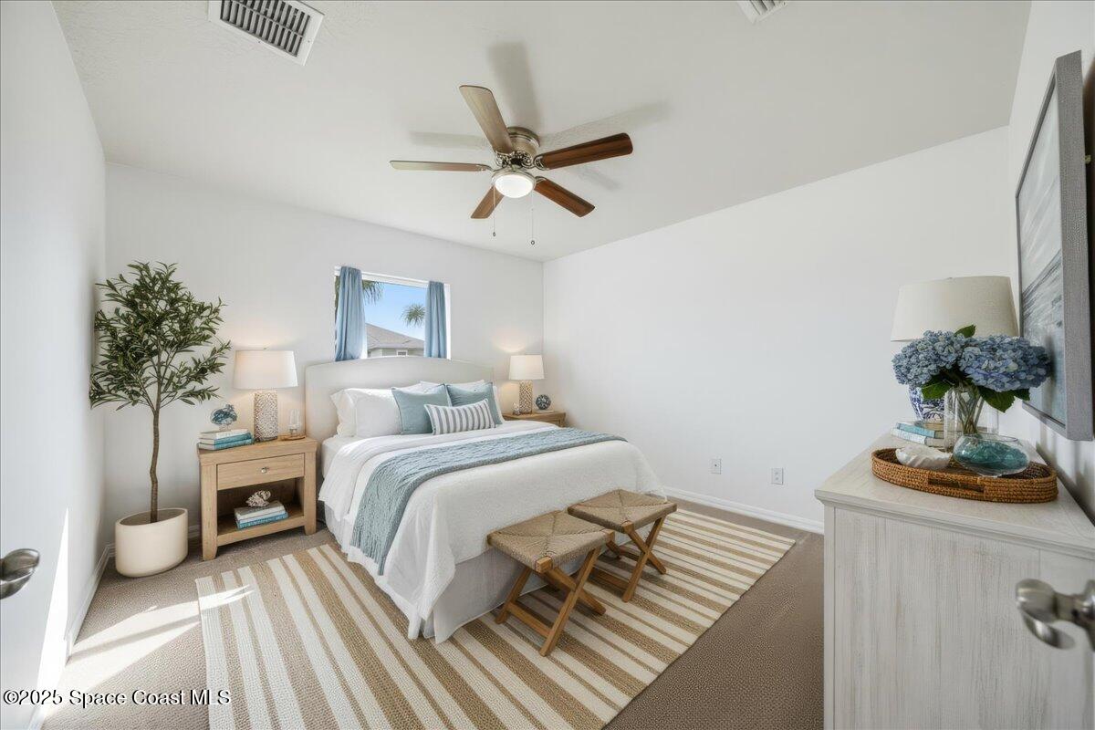 6424 Muller Avenue Cocoa, FL 32927 - Photo 4 of 33 a bedroom with a bed and a potted plant