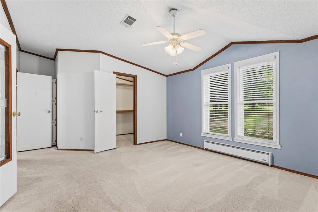 7398 County Road 334 Tyler, TX 75708 - Photo 16 of 39 Coming into Primary Bedroom from Private Den and Large walk-in closet to the left. Primary Bathroom to the left of closet.