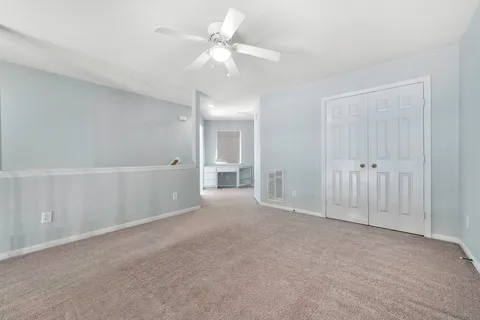 a view of empty room with fan