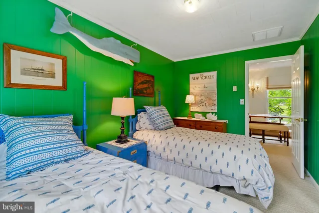 a bedroom with a bed and a chair